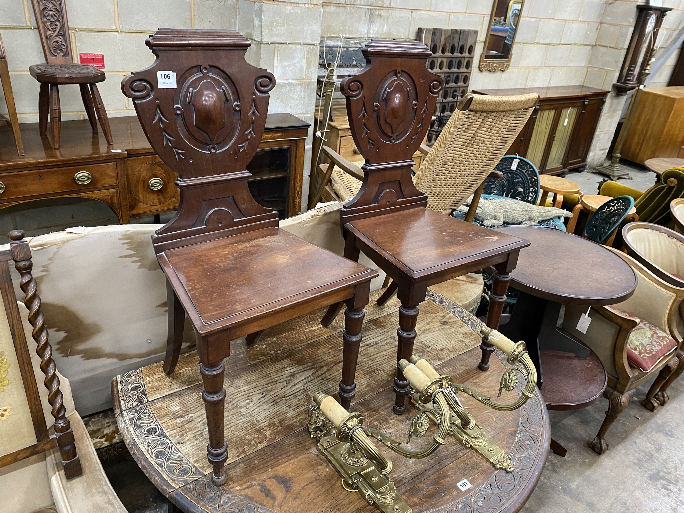 A pair of Victorian mahogany hall chairs, width 44cm, height 91cm